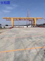 Sell a 600 large drive gantry crane with a full box of 10 tons, a span of 27 meters and a suspension of 9 +9 meters