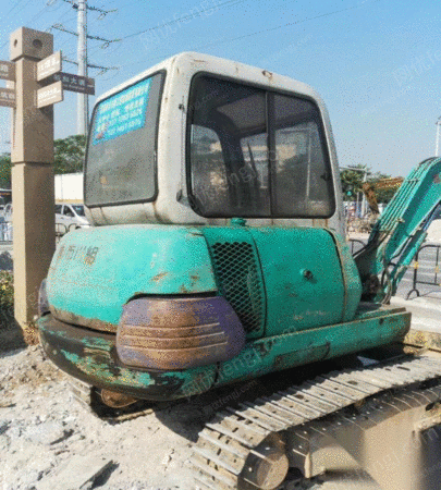 出售二手小松30-7挖掘机带炮